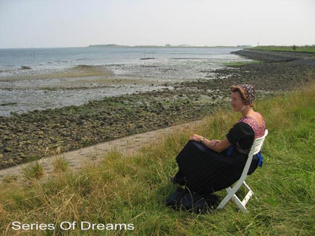 aaltje in costume sitting at the dyke watching the tide_title: series of dreams